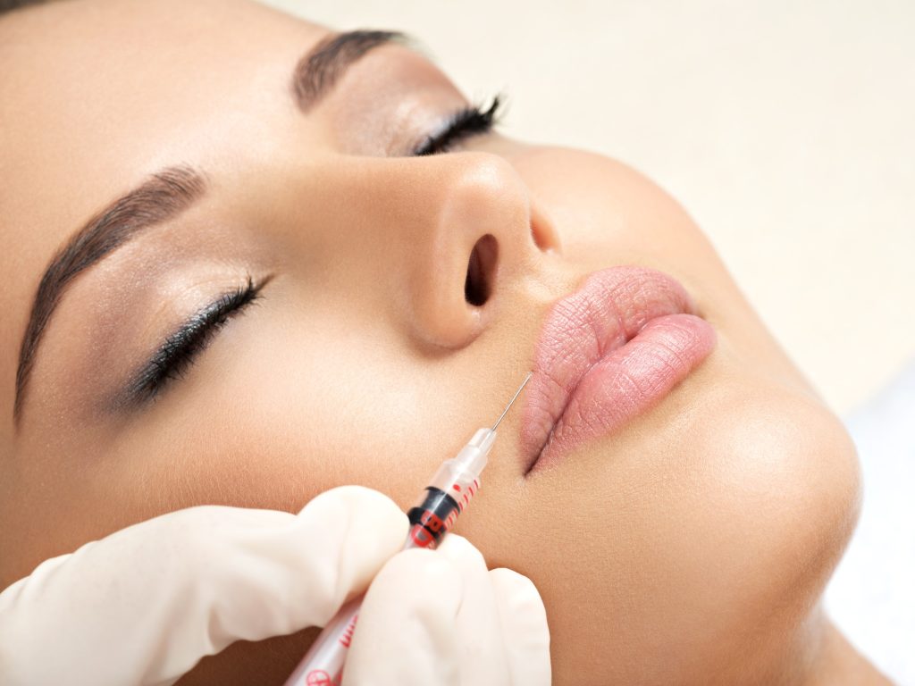 woman gets botox injection in her face